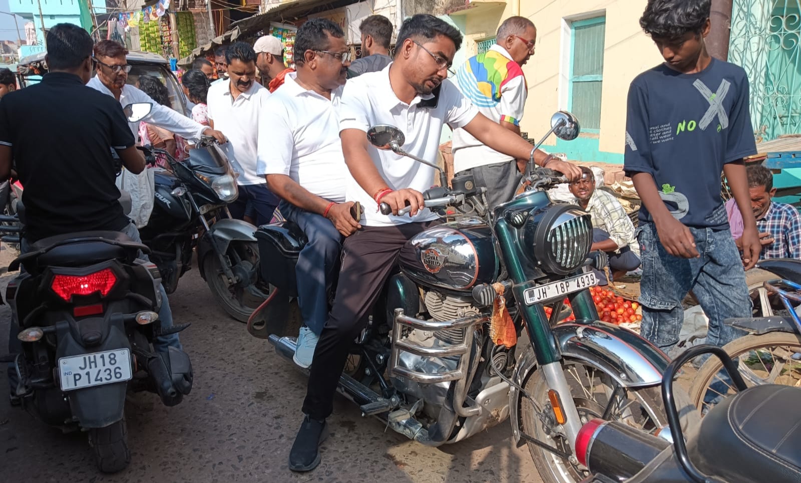 The officer himself made a mockery of the rules: Two senior officers of Sahibganj went out on a Bullet without helmet and talking on mobile.